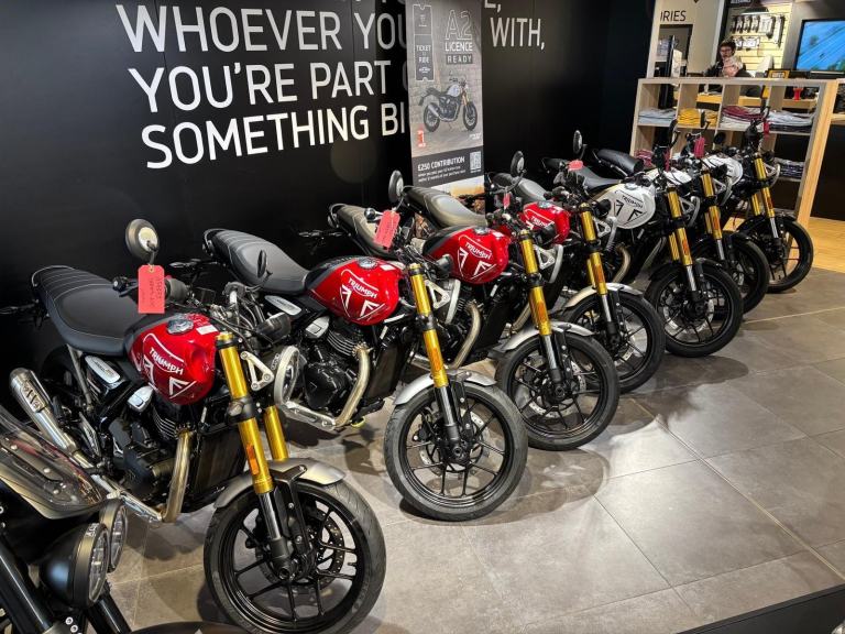 BRAND NEW SPEED 400 IN LAVA RED and PEARL WHITE