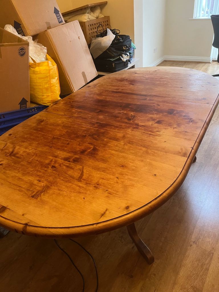 Large extendable solid wood dining table and 8 chairs