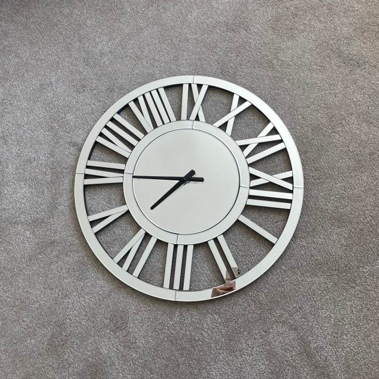 Mirrored Roman numeral wall clock