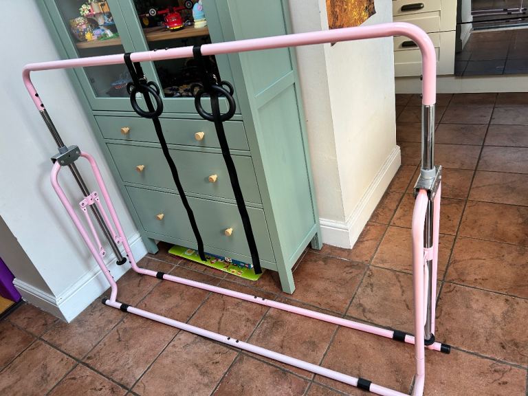 Adjustable gymnastics bar