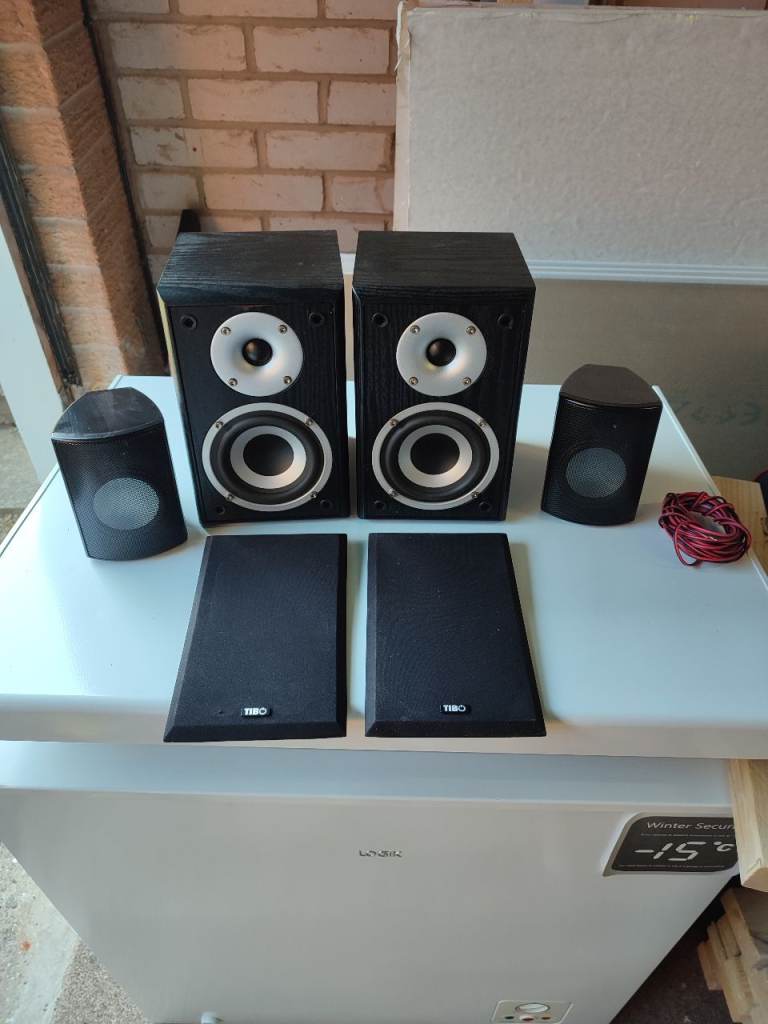 Pair of Black Speakers with Grilles and Small Satellite Speakers