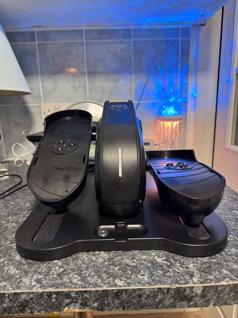 Exerciser for legs while sitting 