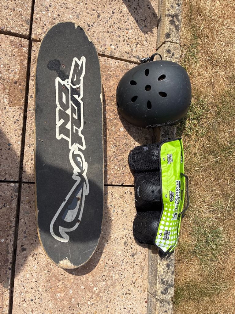 Kids Skateboard with Helmet and Pads – Used Condition