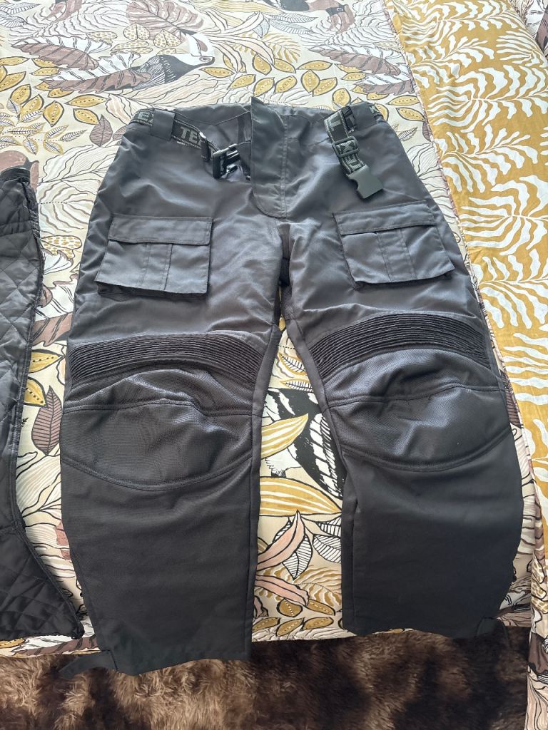 Black motorcycle waterproofs 