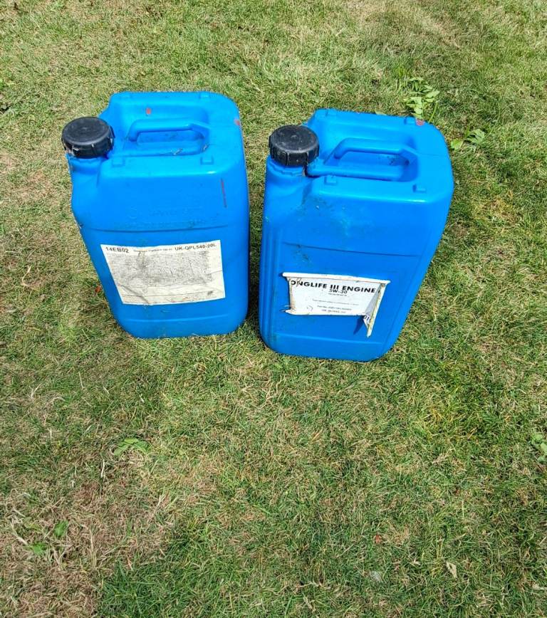 Two Blue Plastic Drums for Fuel Storage