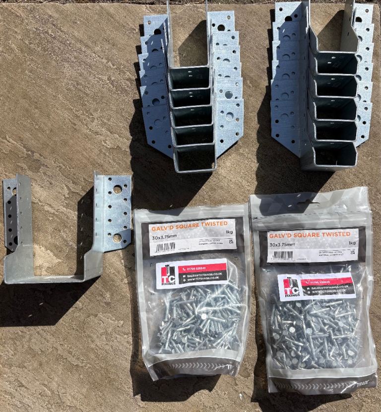Single joist hangers x12; double joist hanger x1; galvanised square twisted nails x1.5 bags