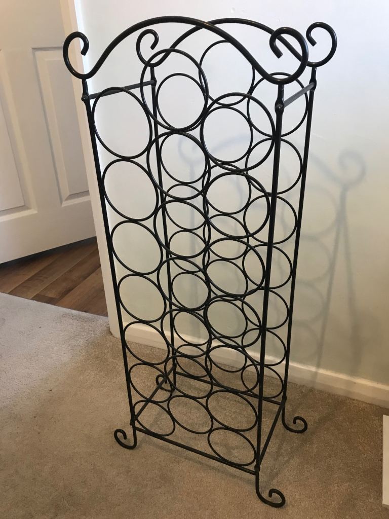 Black metal free standing wine rack