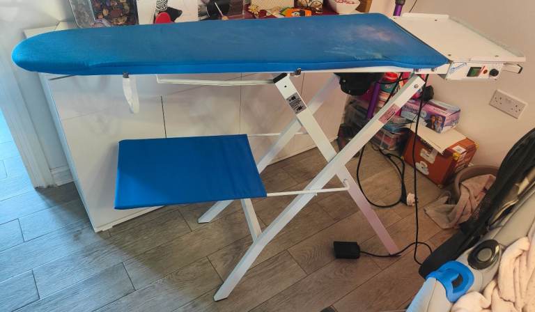 Vacuum and heated ironing board table 