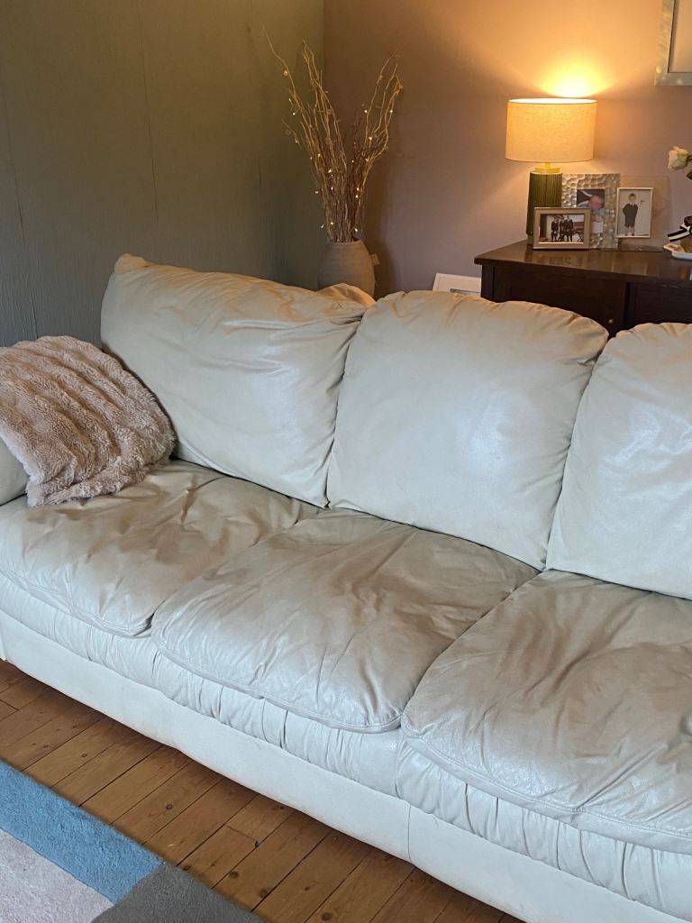 Three and two seater cream leather sofas 
