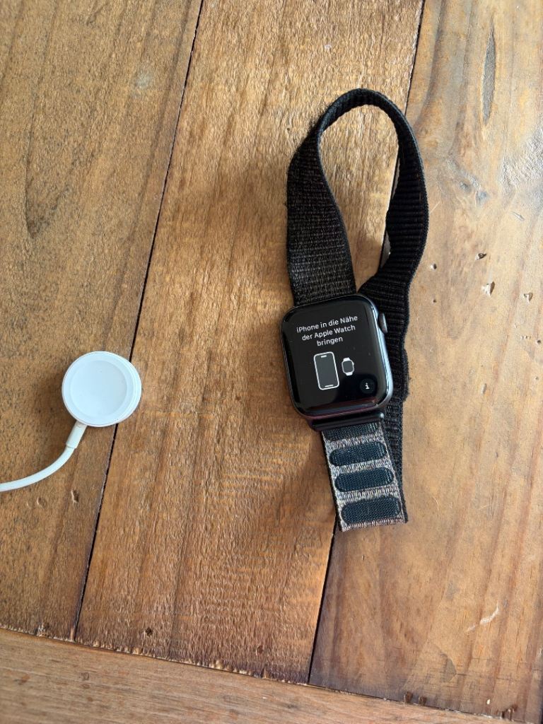 Apple Watch Series 4 with Black Sport Loop and Charger – Good Condition