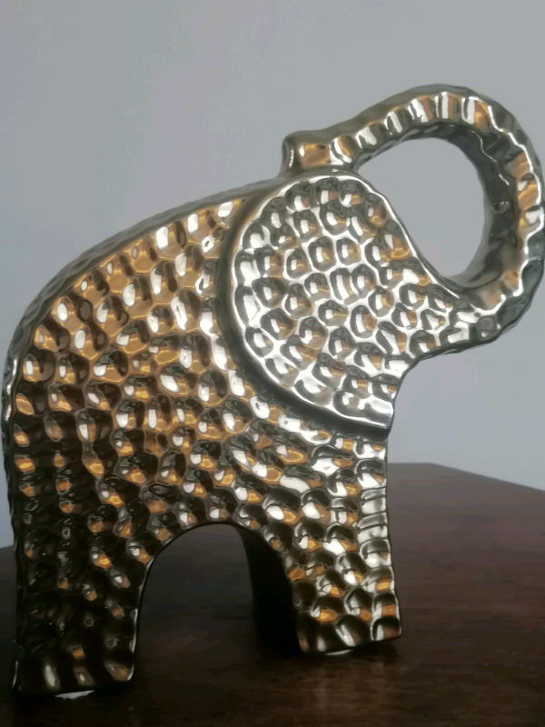 8-inch elephant sculpture. Nice home interior. 