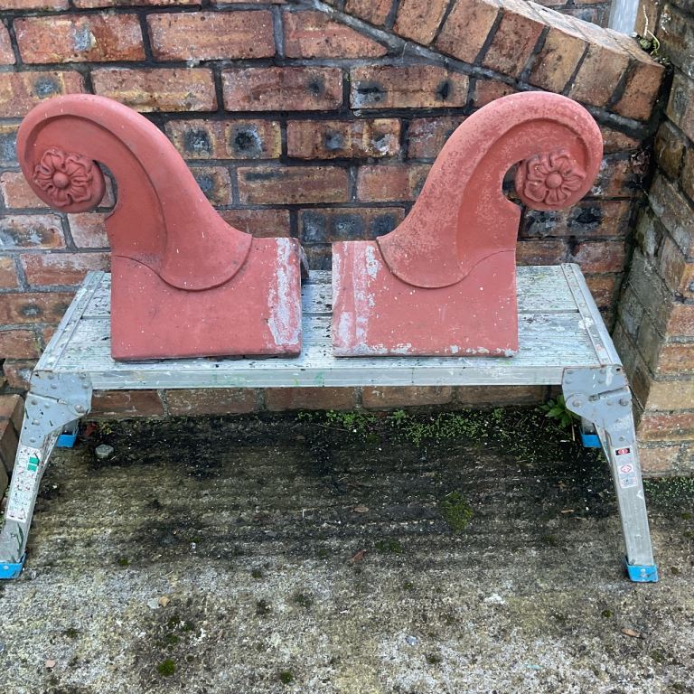 Pair of Red Terracotta Scroll Finial Ridge Tiles