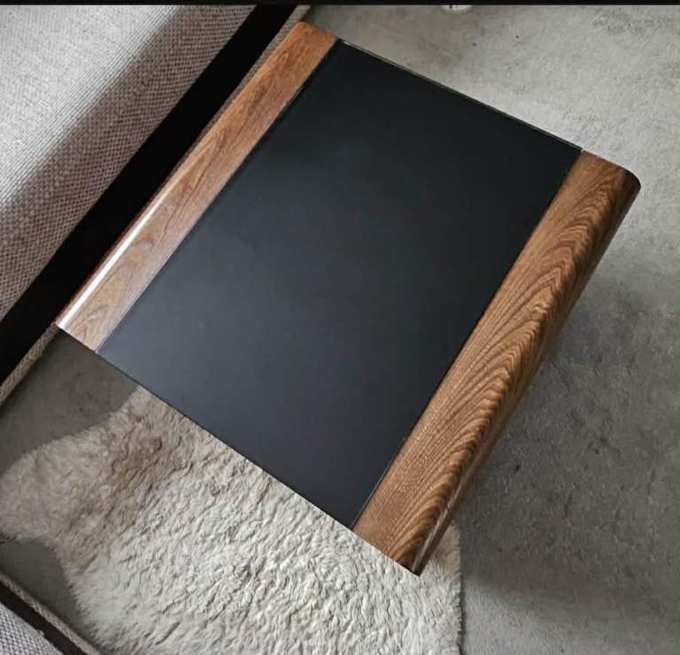 Wooden coffee table with smoked glass top 
