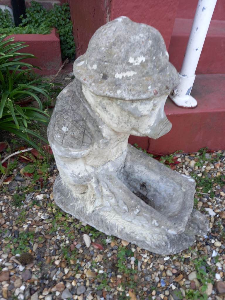Large concrete pig planter