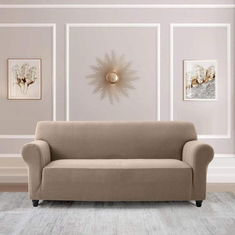The new dark beige sofa cover fits snugly