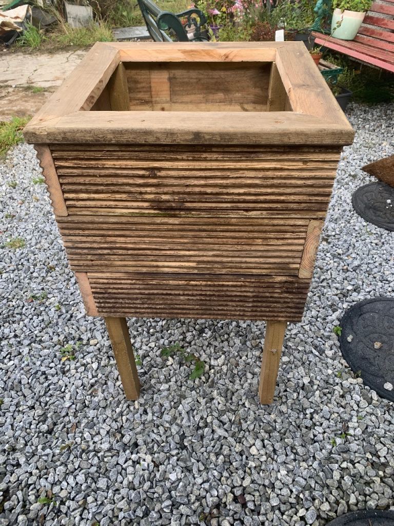 Raised deck board planter