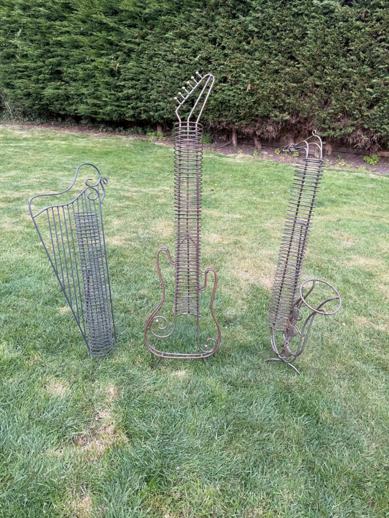 Free standing harp and saxophone cd holder rack