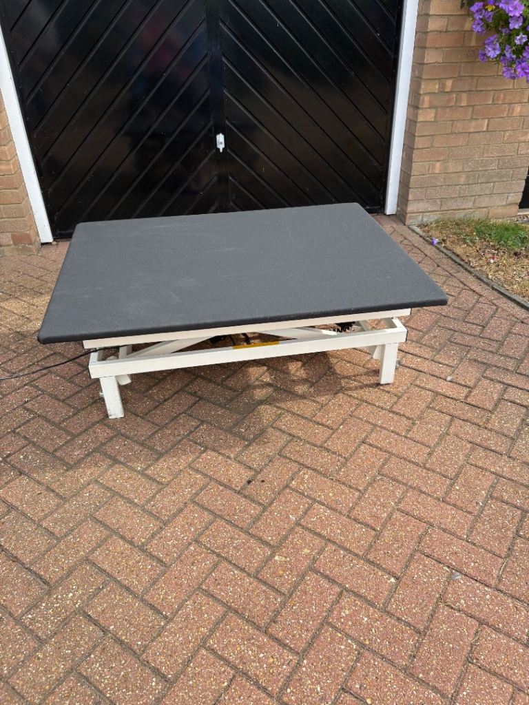 Electrically adjustable work bench/upholstery table with remote control 