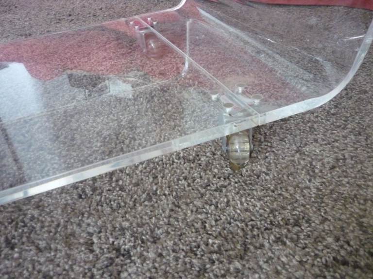 Clear Coffee Table in Acrylic on Casters from Habitat or Heals 