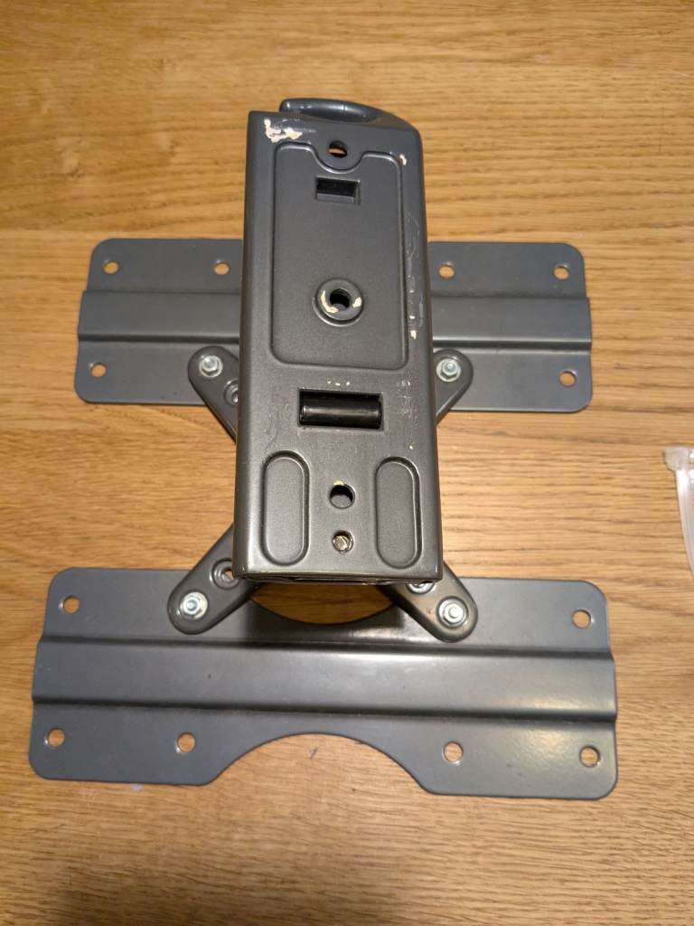 Very strong TV wall mount grey with cable clip.