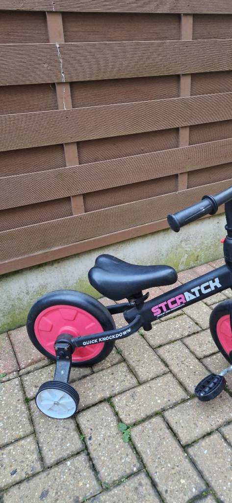 CHILDS BALANCE BIKE WITH REMOVEABLE STABILISERS. EXCELLENT CONDITION.