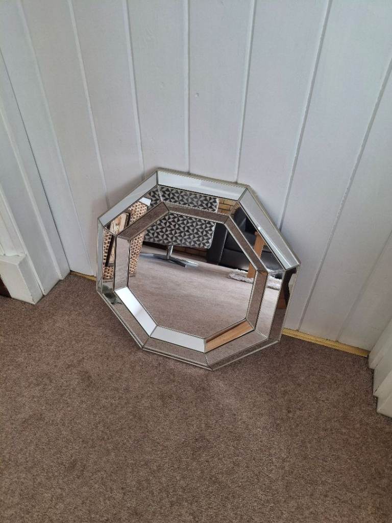 Hexagonal shaped mirror.