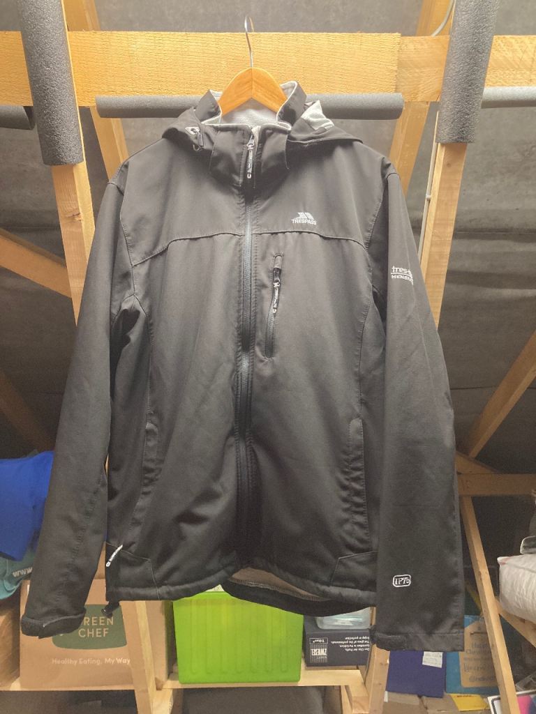 Trespass black hooded men’s waterproof coat.