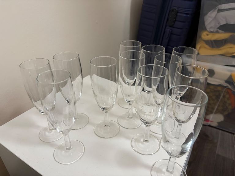 FREE FREE FREE.  Set of 12 Clear Glass Champagne Flutes – Good Condition