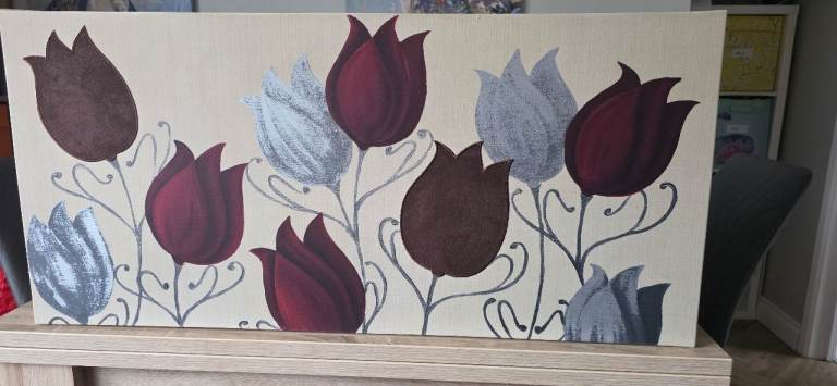 decorative canvas wall art piece featuring a floral tulip design in red and silver. 