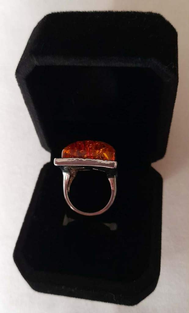 Imitation opal ring in black velvet box 
