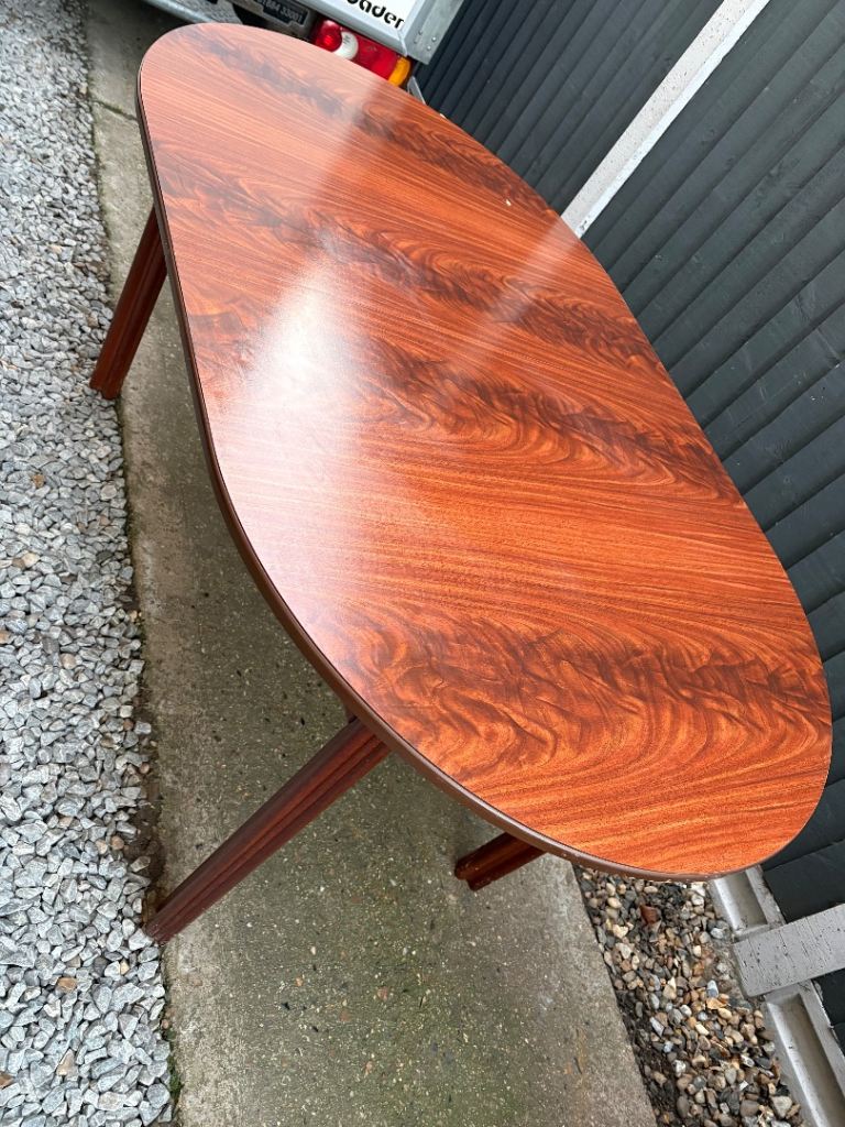 A mid-century modern Danish extendable rosewood dining table