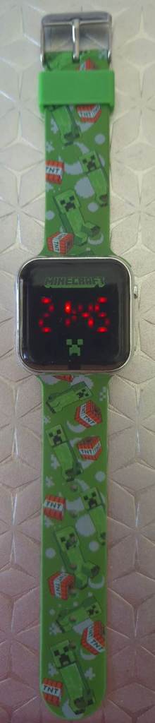 Minecraft LED watch featuring a green silicone strap printed with Creeper and TNT graphics