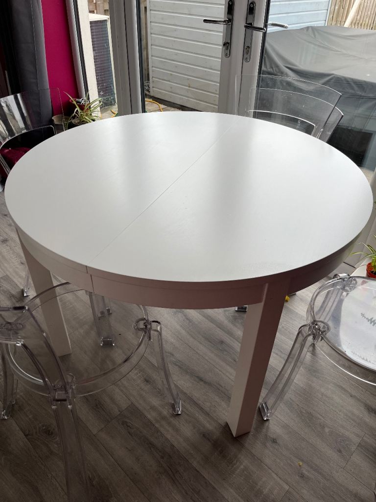 White Extendable Dining Table with Clear Chairs