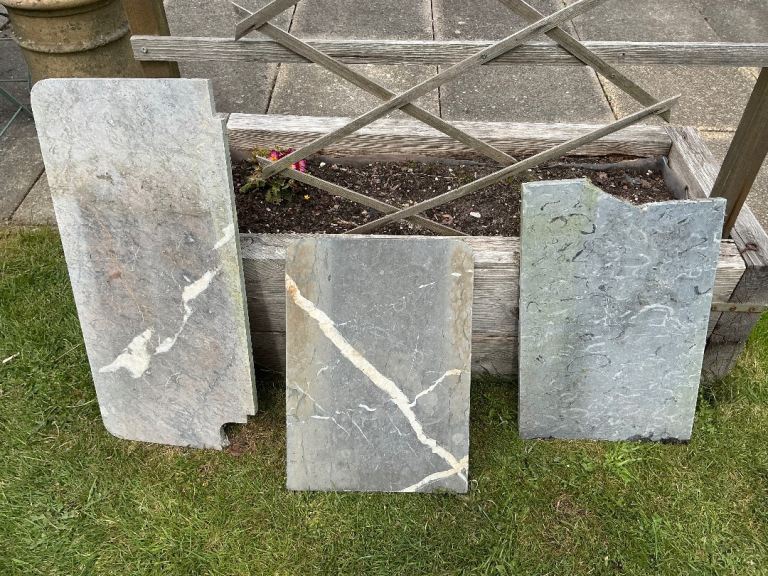 Three pieces of old grey marble