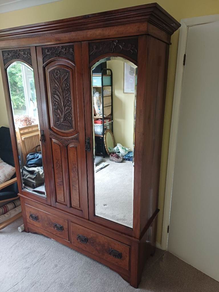 A classic Wardrobe/Coat Cupboard with mirrored doors and decorative front panel.