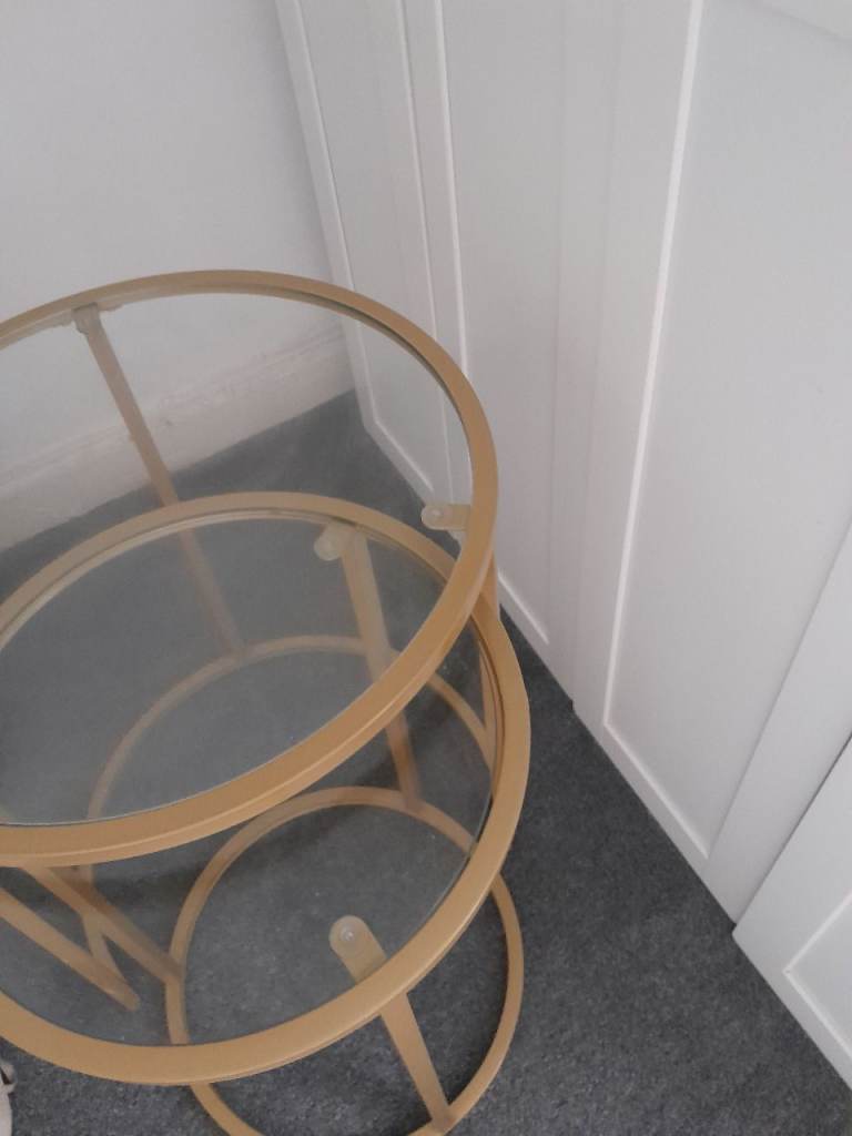Two round gold tables