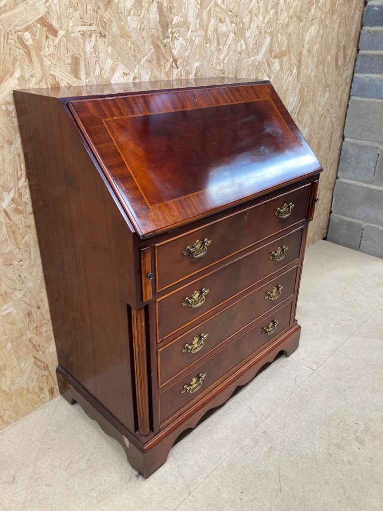 Delivery can be arranged.  Mahogany writing bureau.