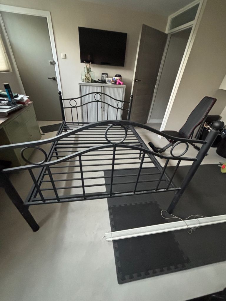 Black metal frame double bed