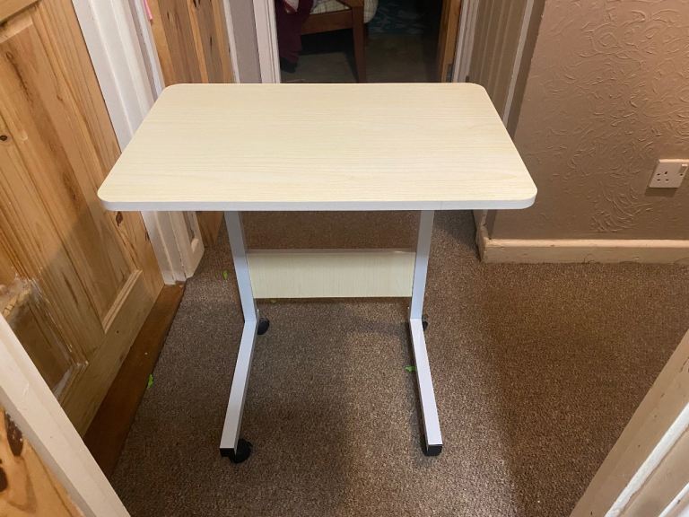 Over the bed adjustable height table 