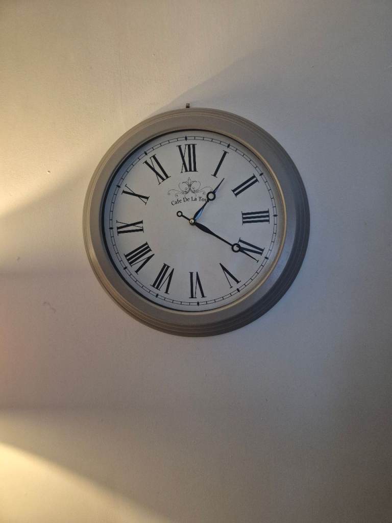 Grey metal wall clock