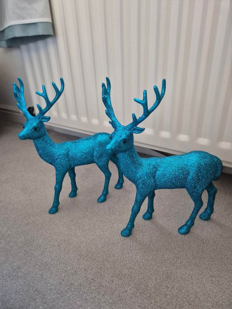 Brightly coloured reindeer Christmas decorations and tree baubles