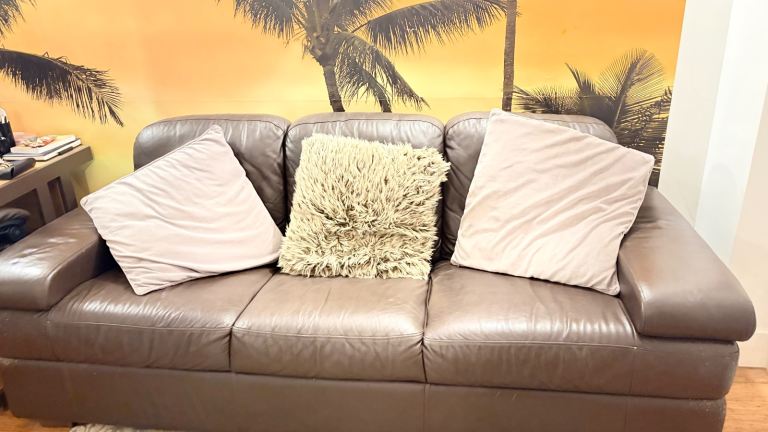 Brown leather three seater sofaBrown leather three seater sofa